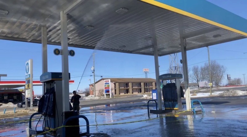 Fuel pump island and canopy being surface cleaned