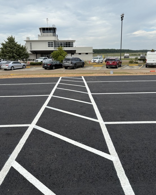Parking lot with new stall lines and a painted cross-hatch lane