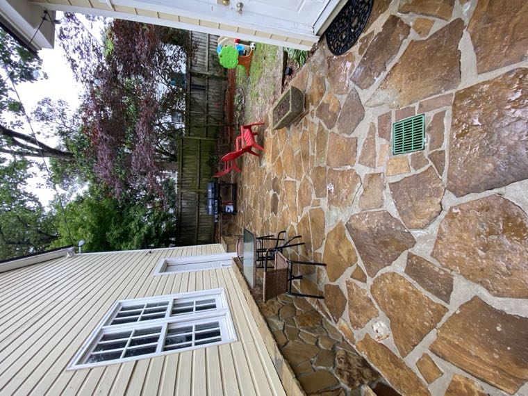 The same flagstone patio after cleaning, warm brown and gold stone